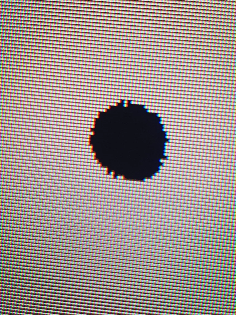TV screen with dead pixel.